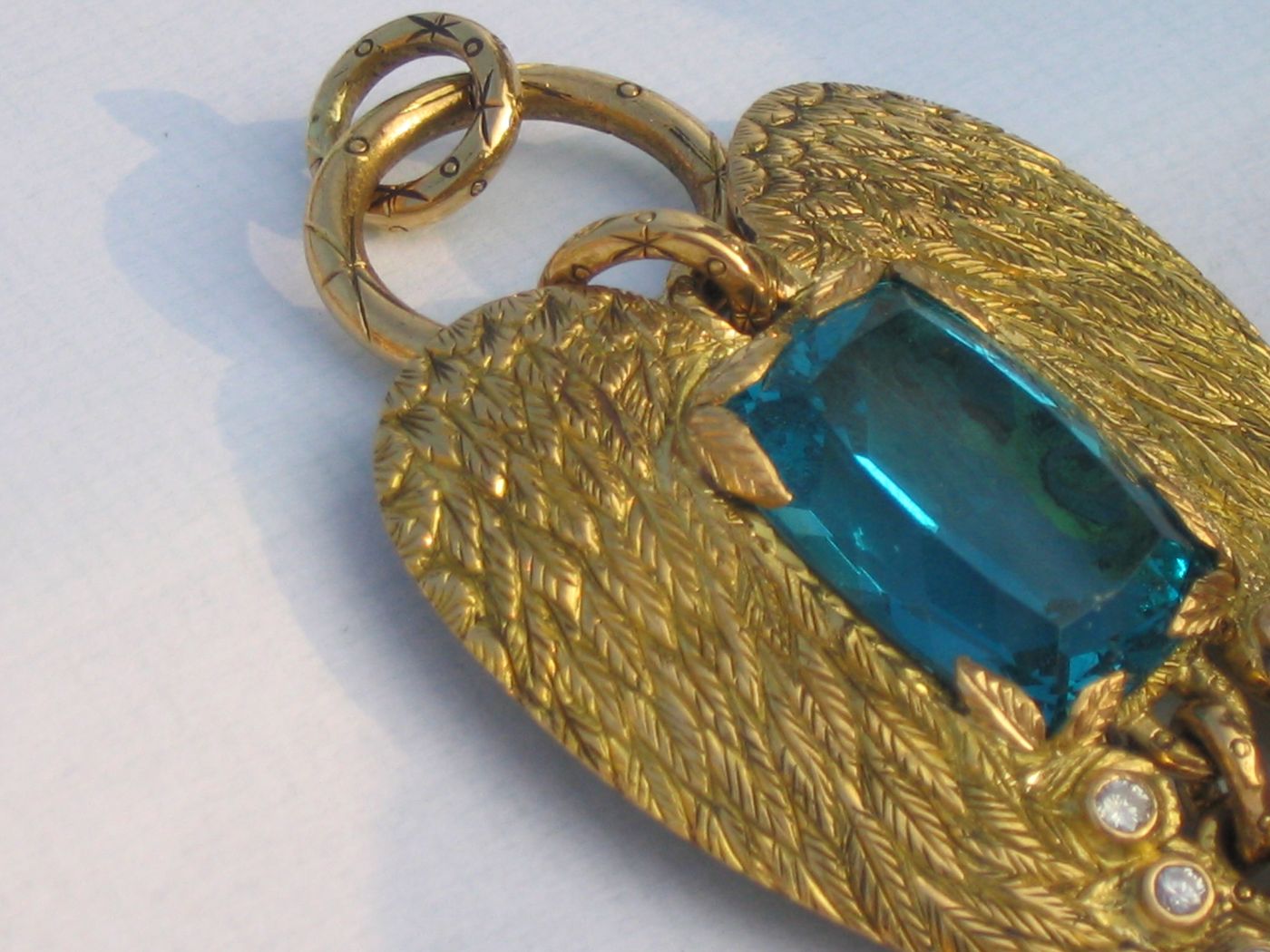 Topaz Feather — 18k gold · London-blue topaz · diamonds